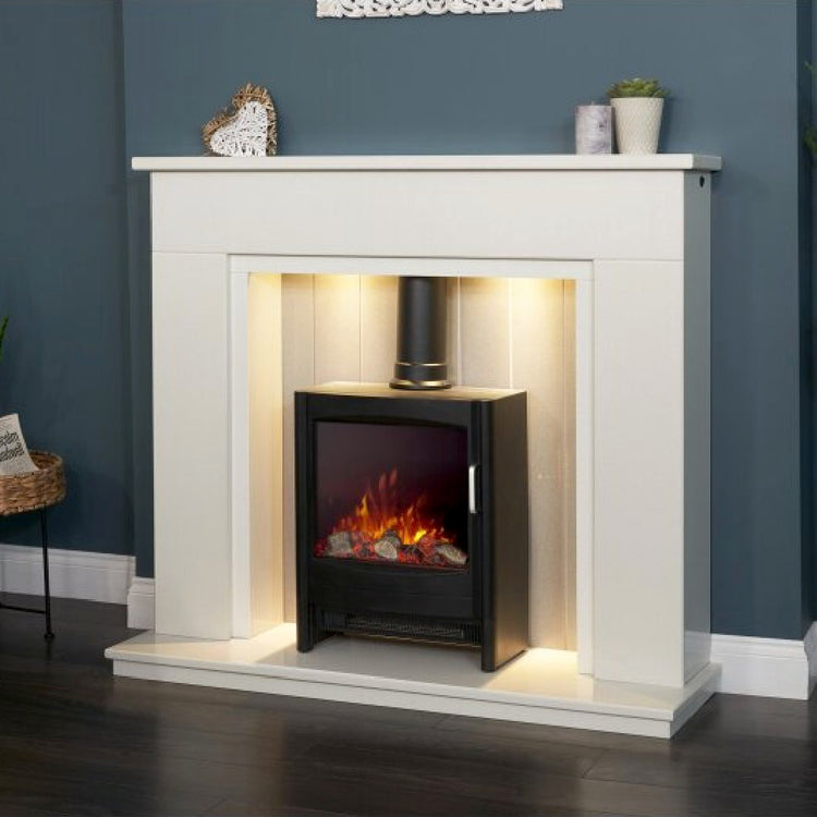 Acanatha marble surround electric fireplace suite in home with downlights turned on