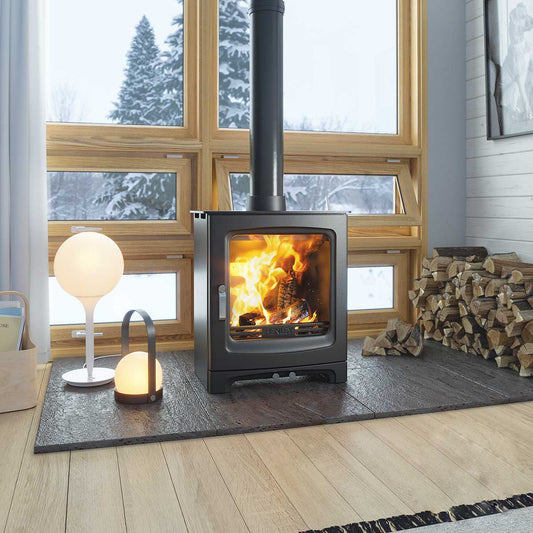 Henley wood burning stove lit with snow view from windows