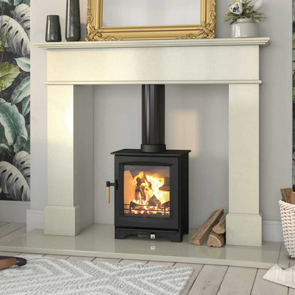 Leaf wood stove lit in white marble enclosure