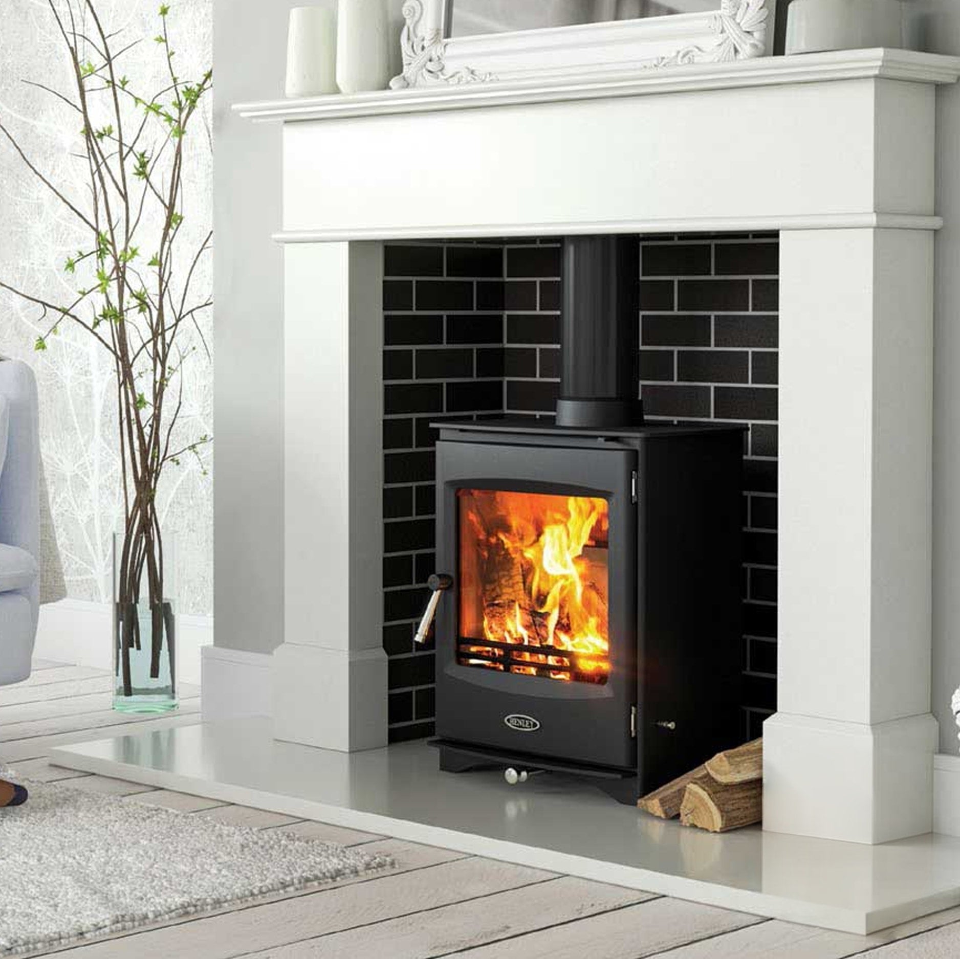 Lincoln wood stove lit in white marble enclosure